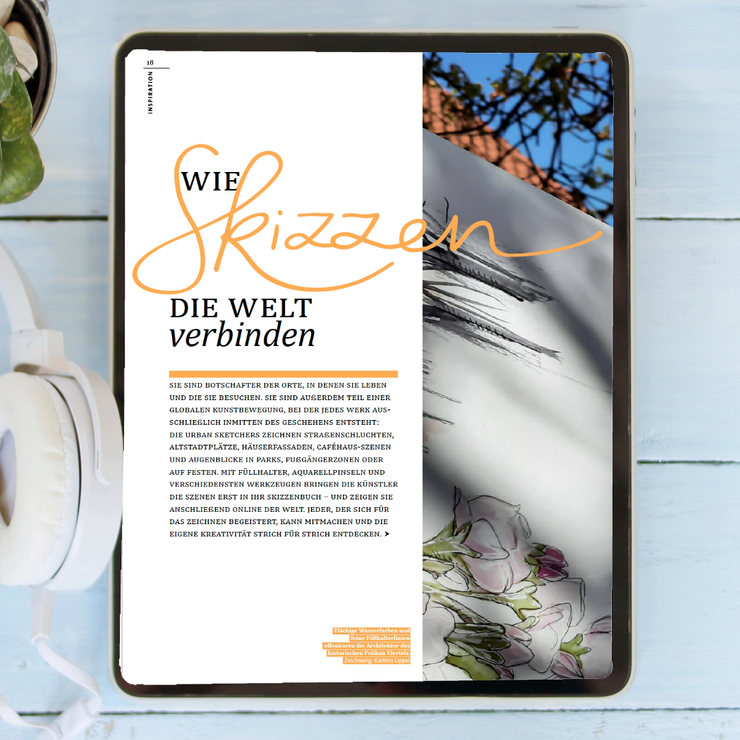 IPad mit geöffnetem Artikel aus dem Pelikan Passion Magazin liegt neben Kopfhörern auf einem blauen Tisch