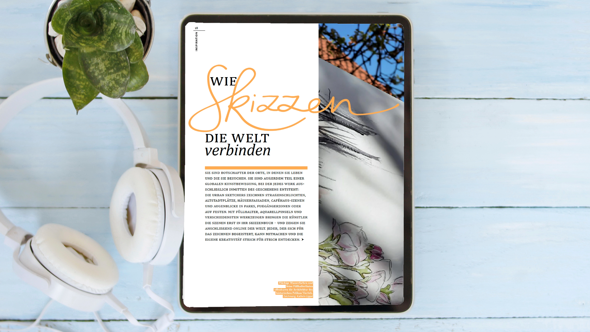 IPad mit geöffnetem Artikel aus dem Pelikan Passion Magazin liegt neben Kopfhörern auf einem blauen Tisch